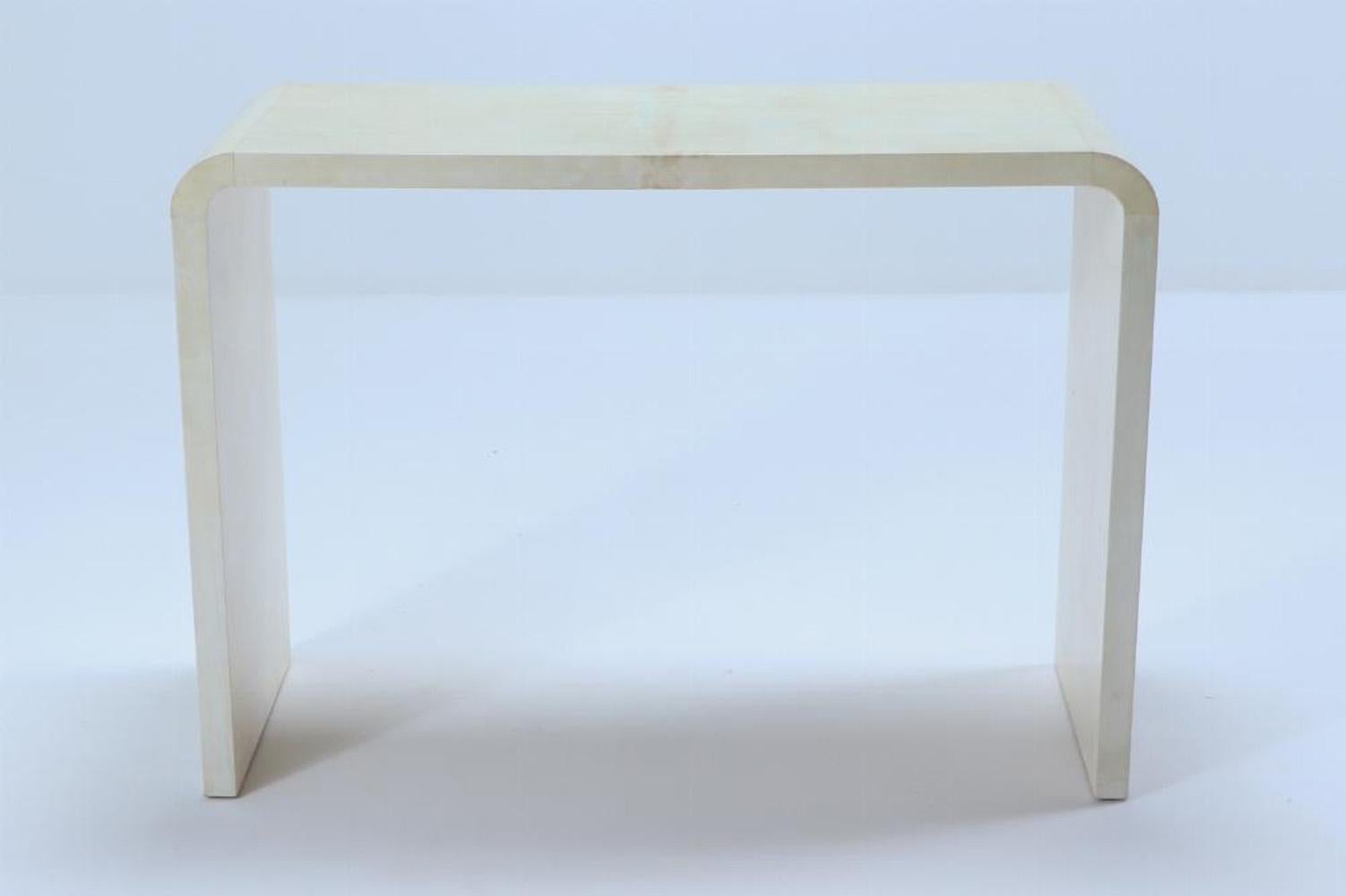Parchment Paper A pair of waterfall console tables in the manner of Jean-Michel Frank.