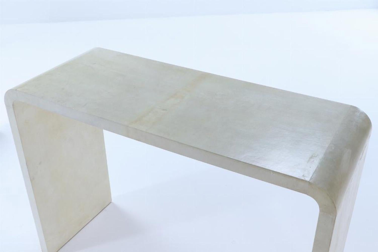 A pair of waterfall console tables in the manner of Jean-Michel Frank. 2