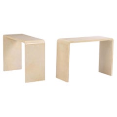 A pair of waterfall console tables in the manner of Jean-Michel Frank.