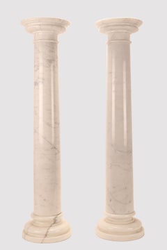A pair of white Carrara marble columns, Italy 1930s.