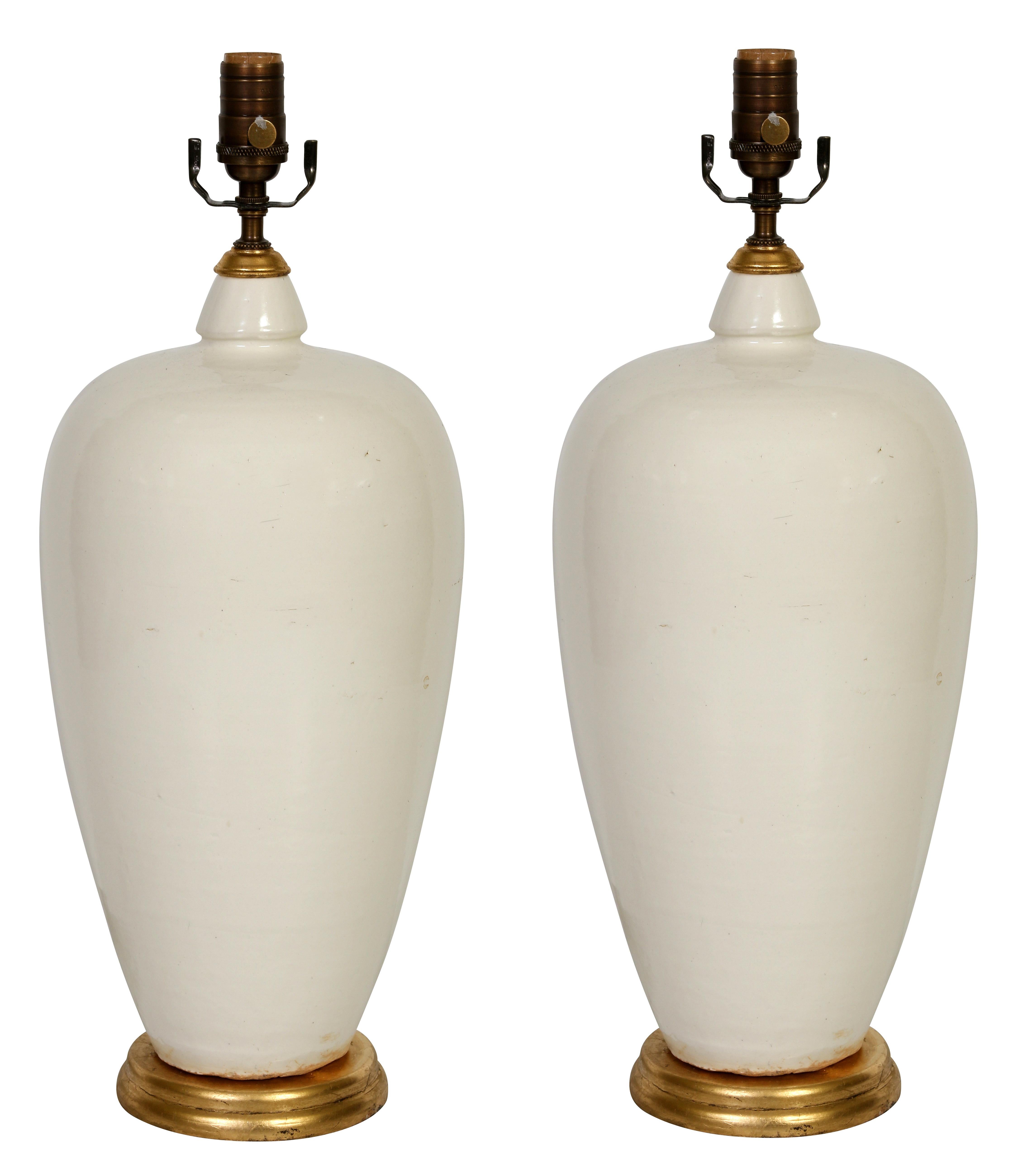 Chinese Pair of White Ceramic Lamps with Gold Base