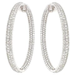 A Pair of White Gold and Diamond Hoop Earrings.