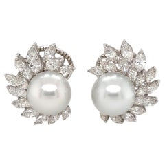A Pair of White Gold, Pearl and Diamond Earrings.