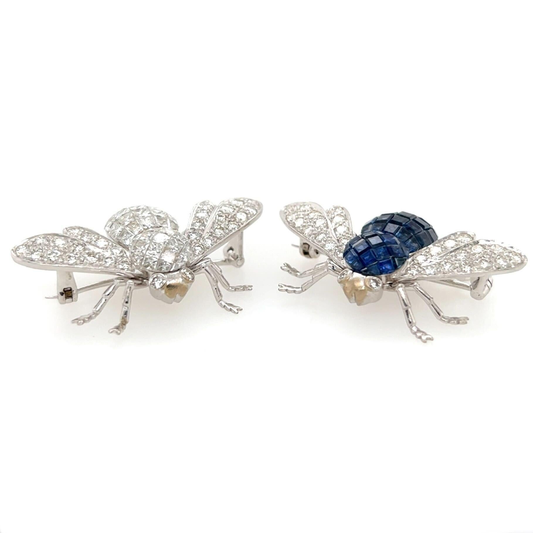 A pair of 18 karat white gold, sapphire and diamond brooches.  Fashioned as a bee set with forty nine (49) calbre cut diamonds and twenty nine (29) briliant cut diamonds.  The second bee set with forty nine (49) calibre cut sapphires and twenty nine