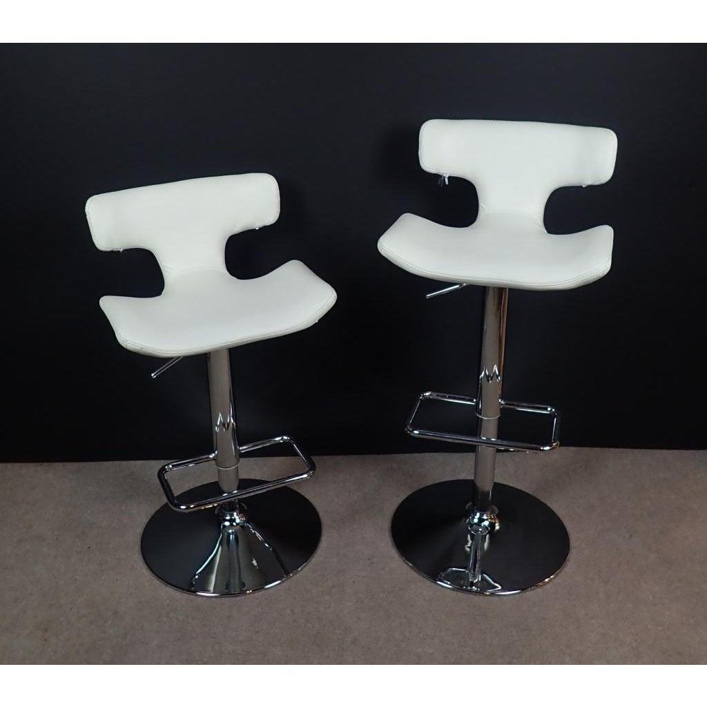 A pair of white leather and chrome modern adjustable swivel counter stools. Set of two adjustable height modern bar stools.
Chrome base with footrest.
White leather seats in a modern design.