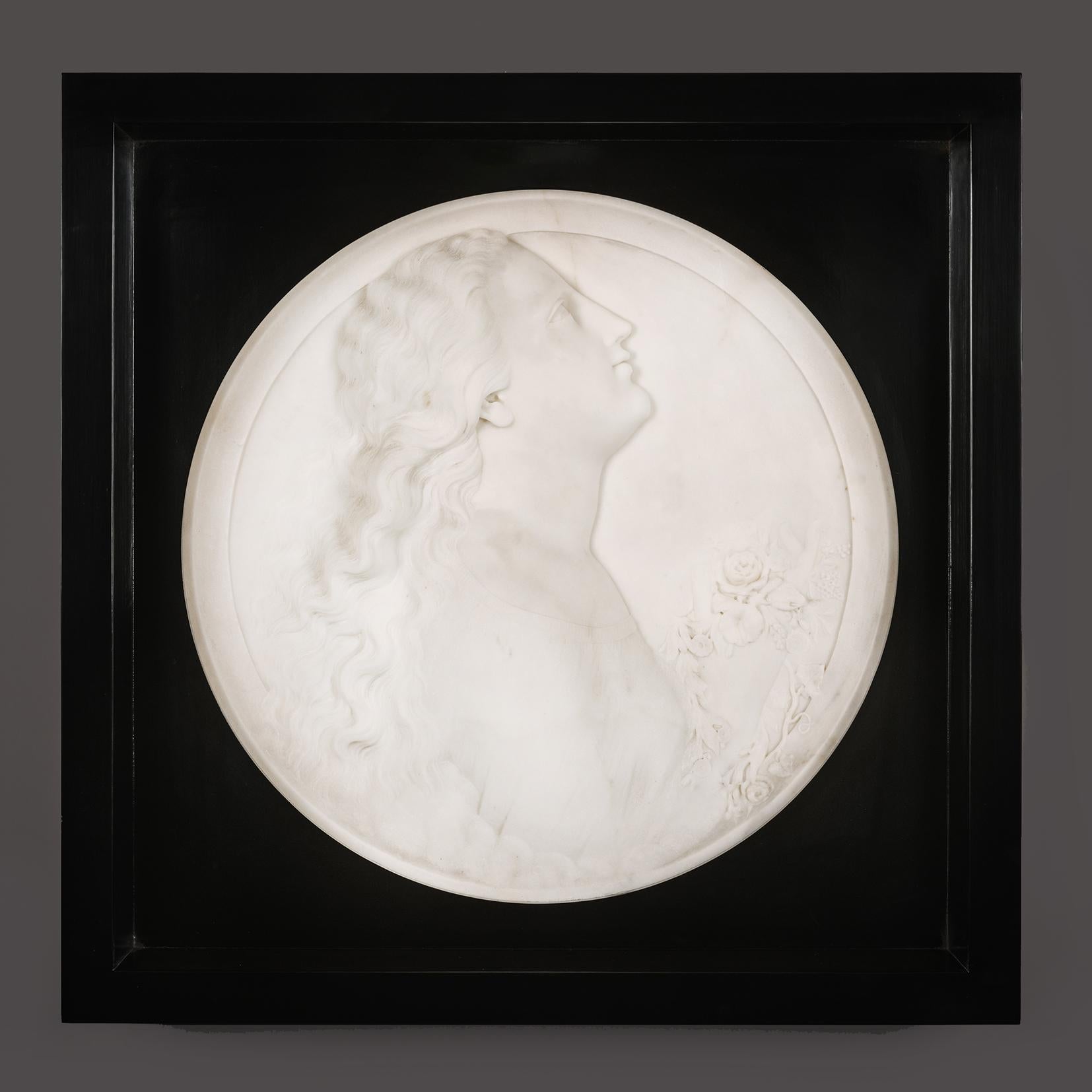A Pair Of White Marble Portrait Roundels Of Female Portraits Representing 'Morning' and 'Evening', By Madison Colby (American, 1842-1871).

White statuary marble.

'Morning' signed ’M. Colby’.

Italy, Circa 1868.

These large portrait roundels