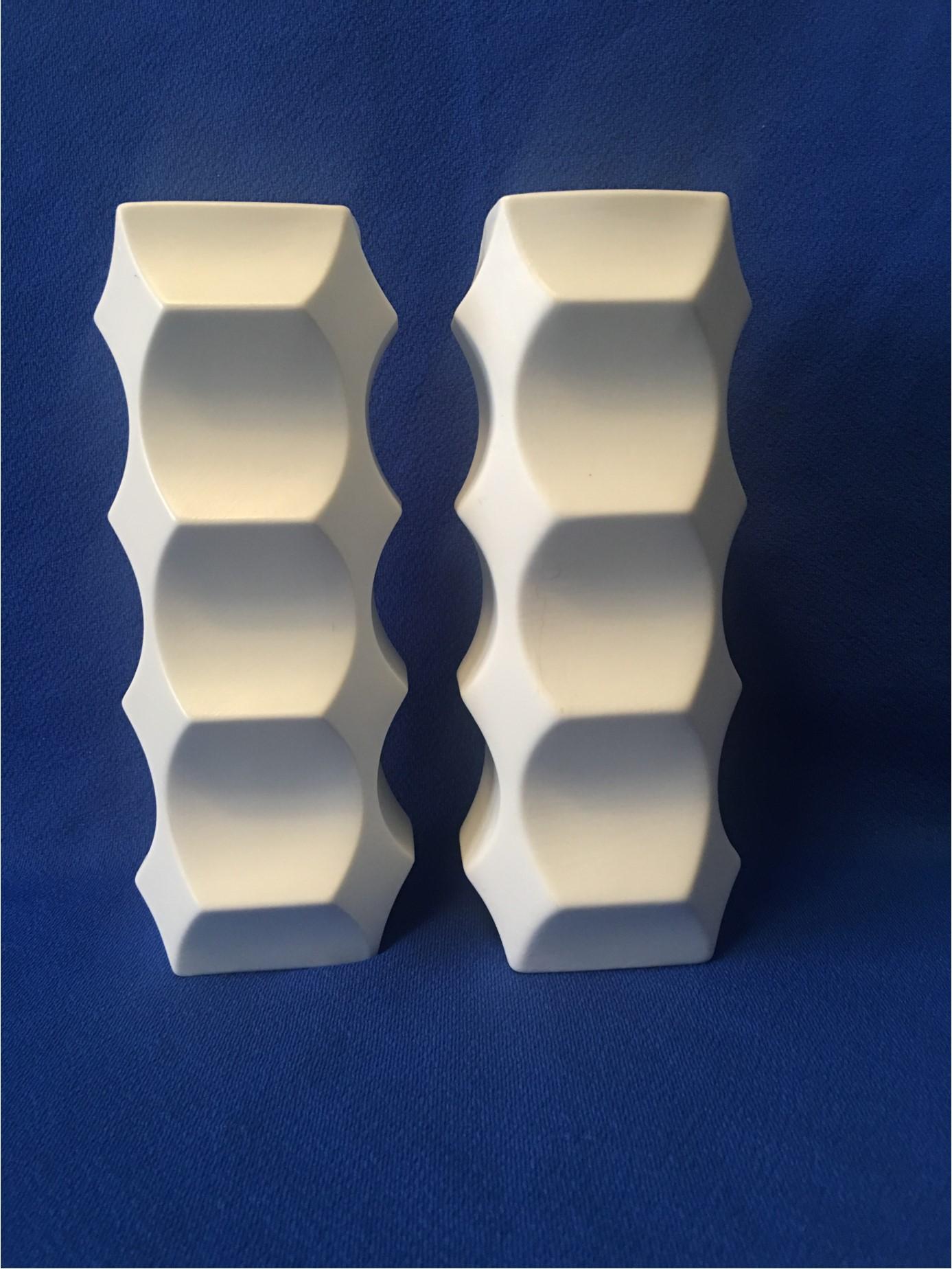 A nice pair of white bisque porcelain vases from the 1960s with a design by Heinrich Fuchs. Manufactured by Hutschenreuther Porcelain Company of Selb, Germany. The city and the porcelain company are renowned as 