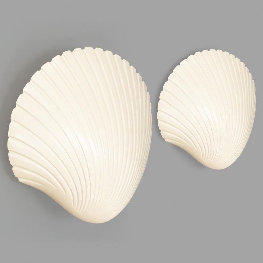 Beautiful pair of shell-shaped wall sconces by Michèle Mahé and André Cazenave for Atelier A, dating from the late 1960s. The stunning organic design is crafted from fiberglass.

The shell illuminates with translucency when lit, emitting a beautiful