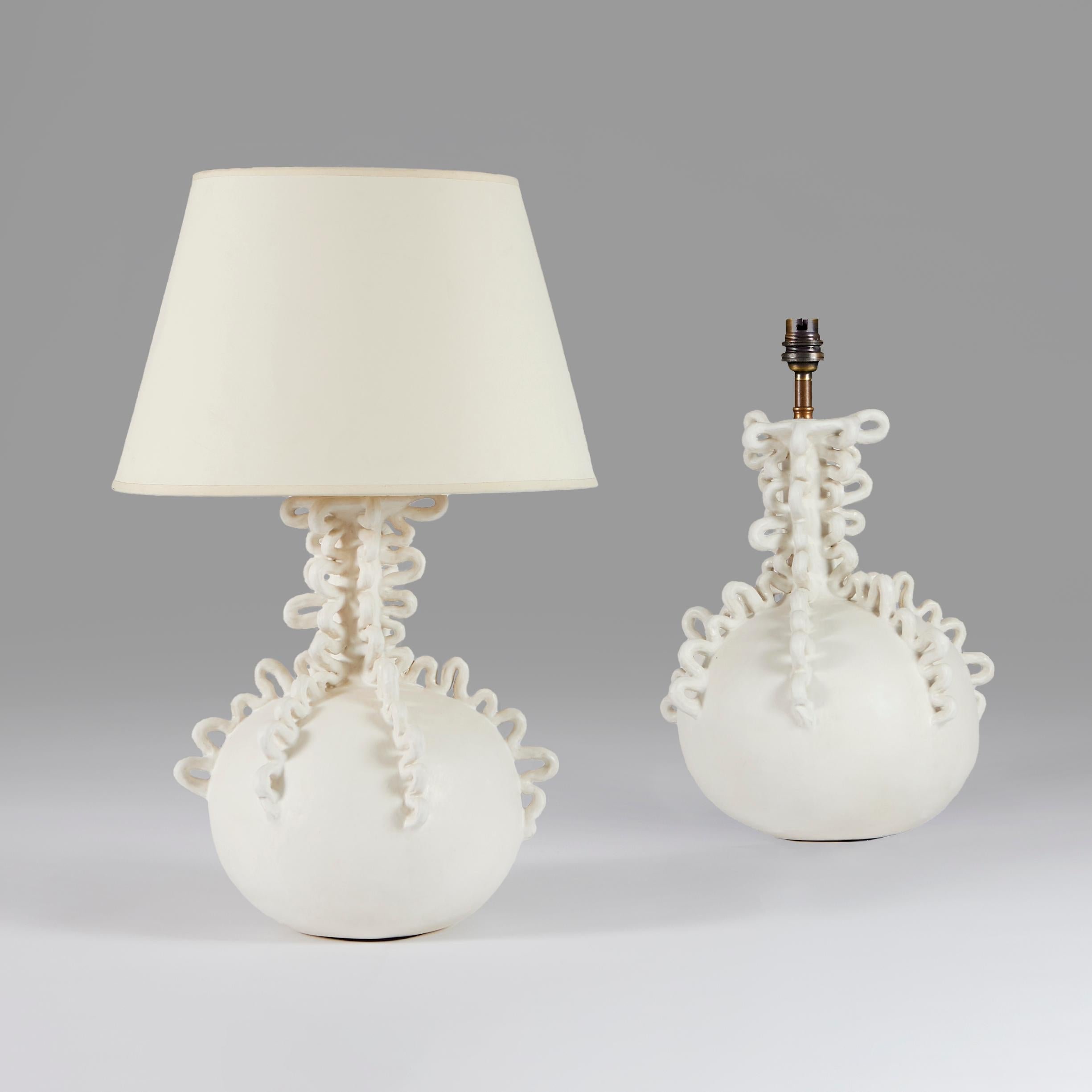 +VAT

England, made to order. 

A pair of abstract stoneware lamps of large globular bottle form with six serpentine trails applied down the neck and finished in a matte white glaze. 

Lead time: 6 - 8 weeks.

Height 44.00cm 
Diameter
