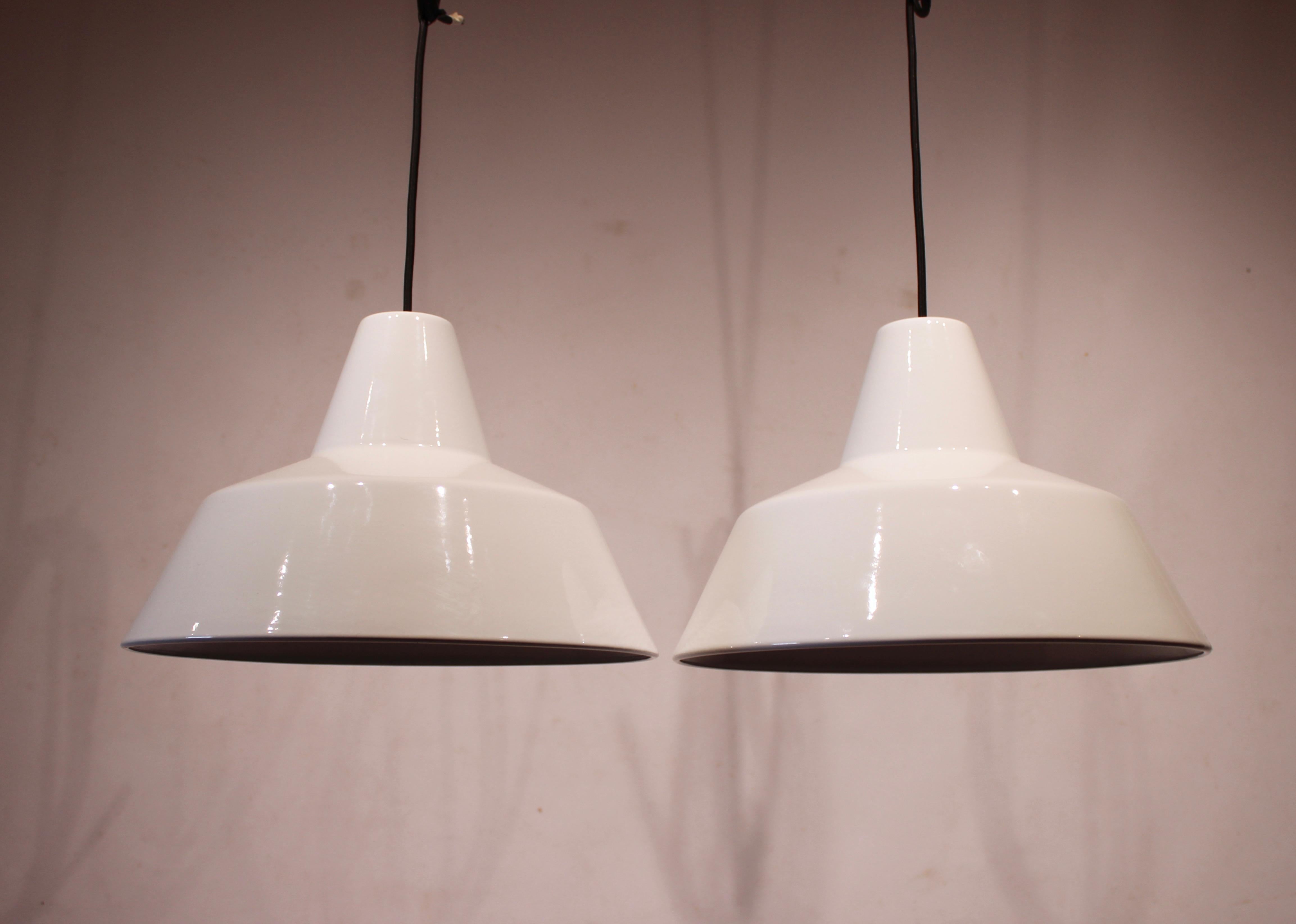 A pair of white workshop lamps designed by Louis Poulsen from the 1970s is a charming and functional find that showcases the enduring appeal of industrial design.

Louis Poulsen, a renowned Danish lighting manufacturer, is known for its high-quality