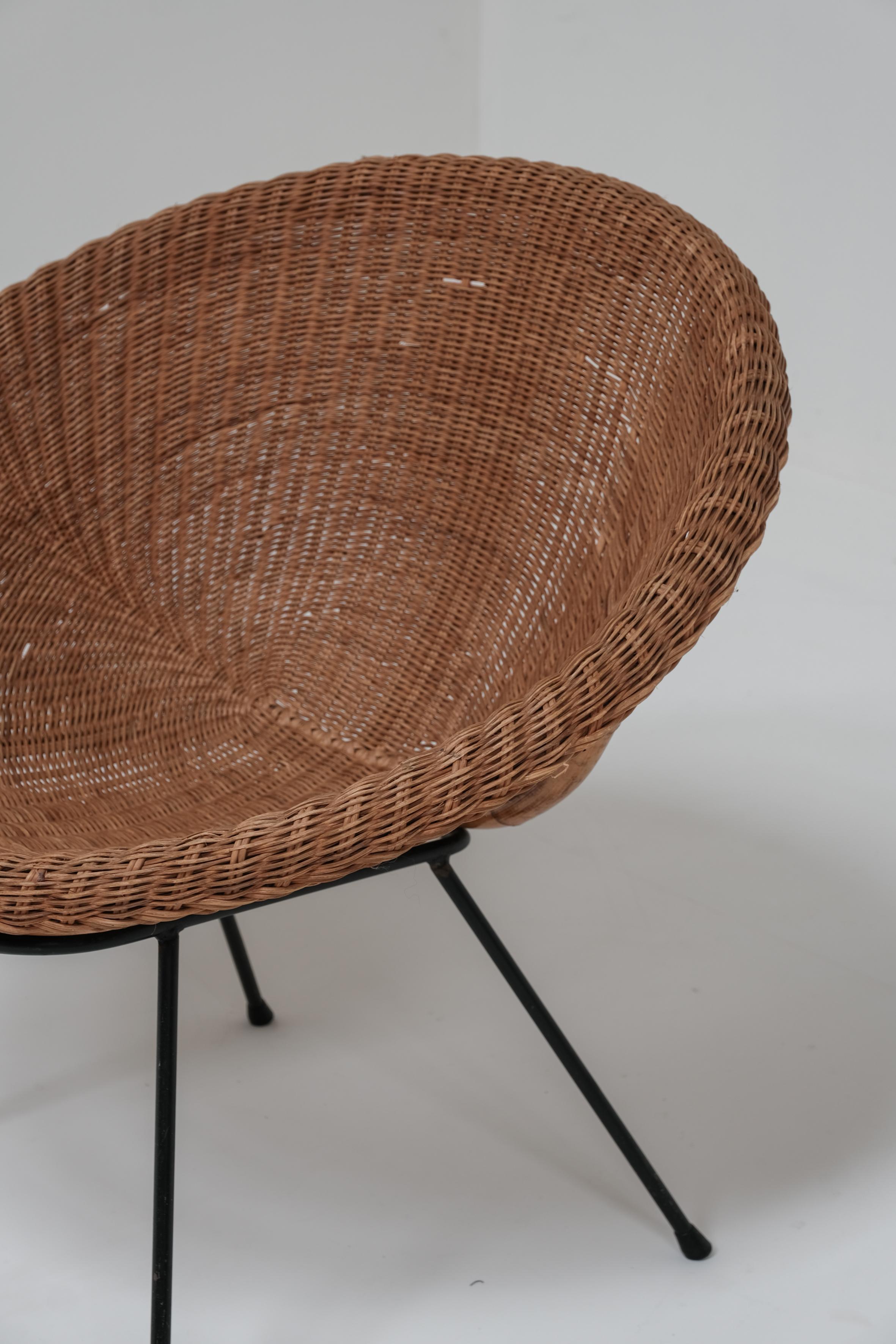 A pair of wicker bucket chairs 1970 2