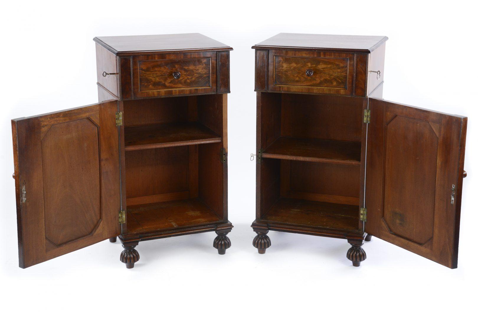 A pair of William IV mahogany pedestal cupboards, in the manner of Gillows, each with panel door and draw on reeded supports.

Gillows of Lancaster and London, also known as Gillow & Co., was an English furniture making firm based in Lancaster,