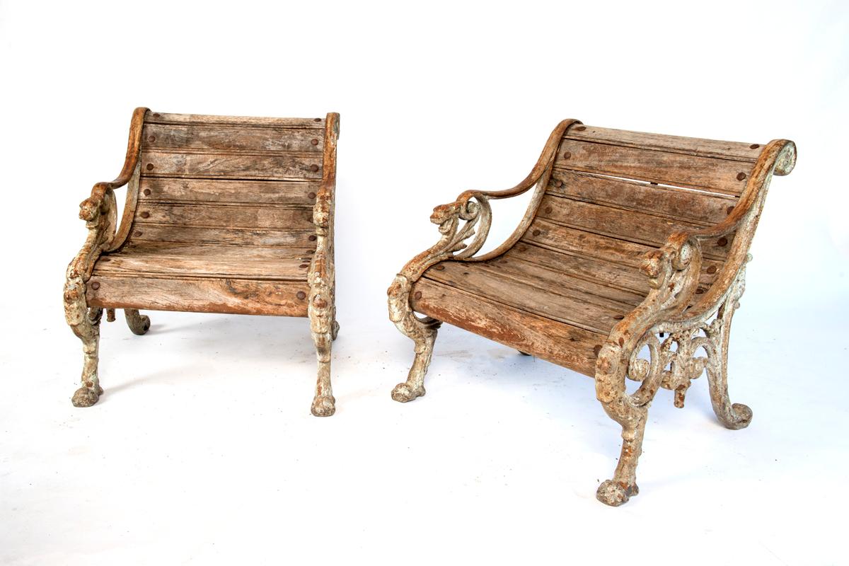 A pair of wood and cast iron garden seats.