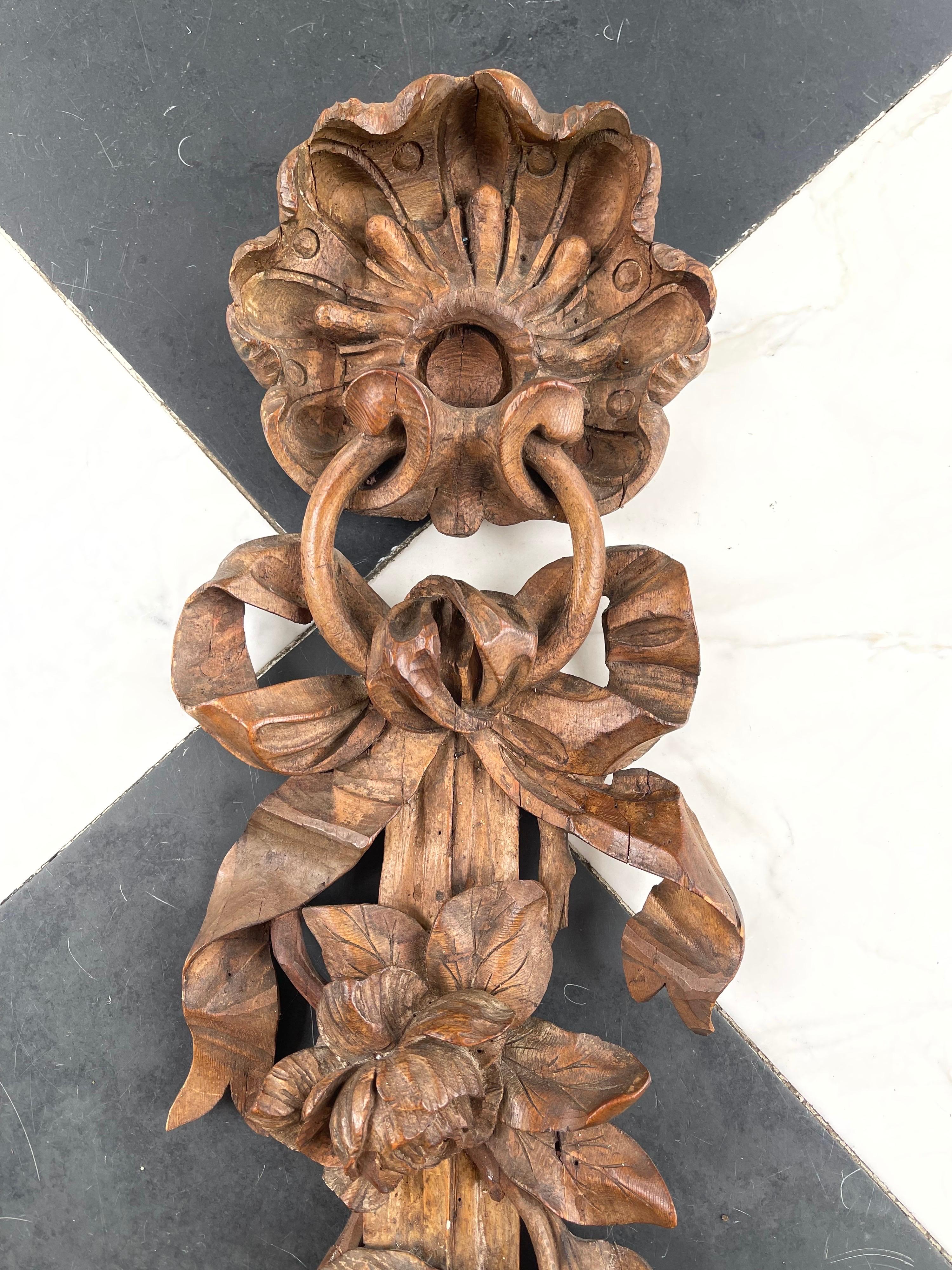 An exceptional pair of English wall carvings in the manner of the master carver Grinling Gibbons (1648-1721).
The hand who carved these three dimensional fruit, flowers, vegetables and leaves are hanging from a ribbon attached to a shell. They date