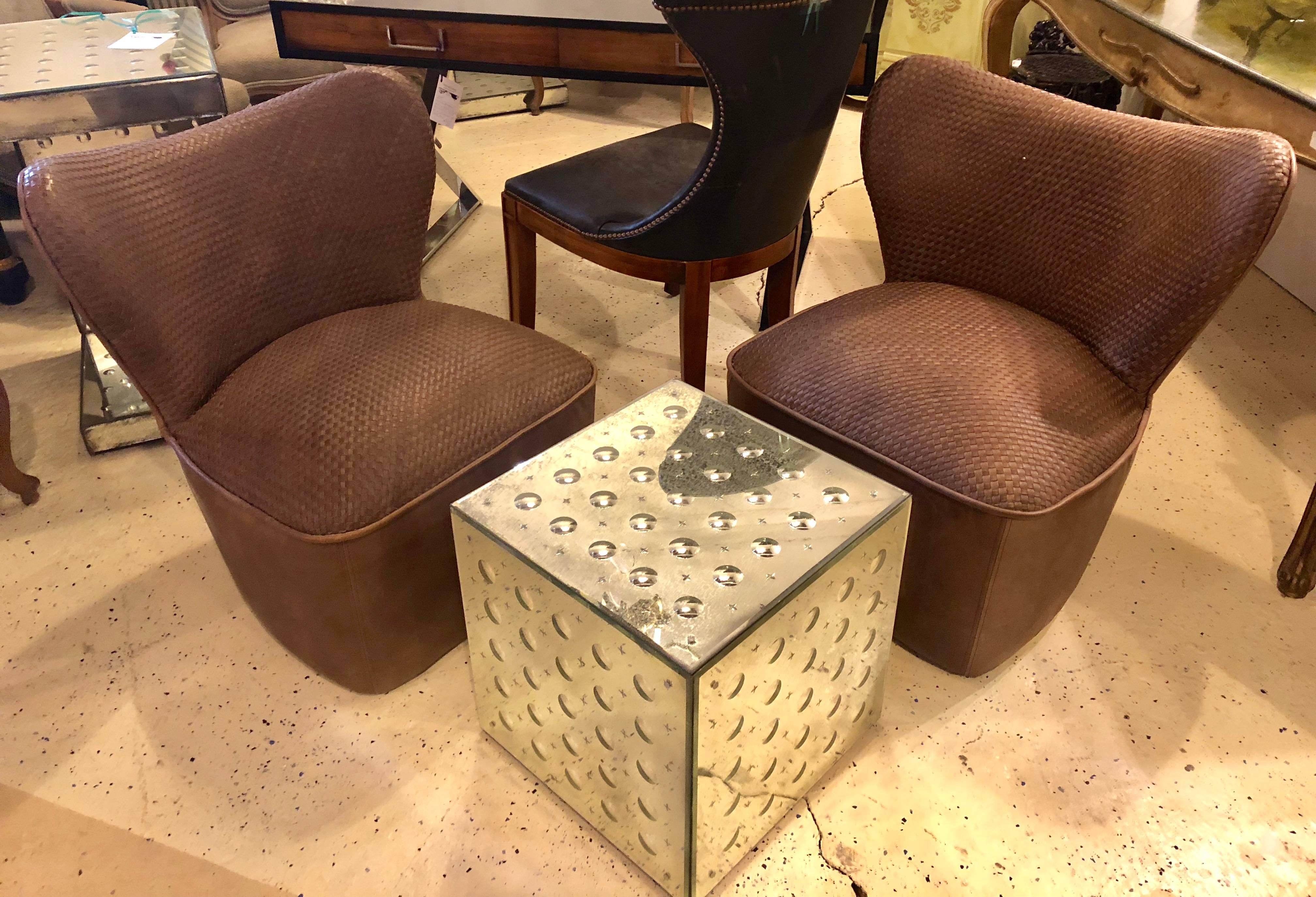 A pair of woven modern leather seat and backrest side chairs in brown leather tweed. The pair are quite comfortable. Very fashionable and desirable. I have two pair of these one in this color and in a grayish color.