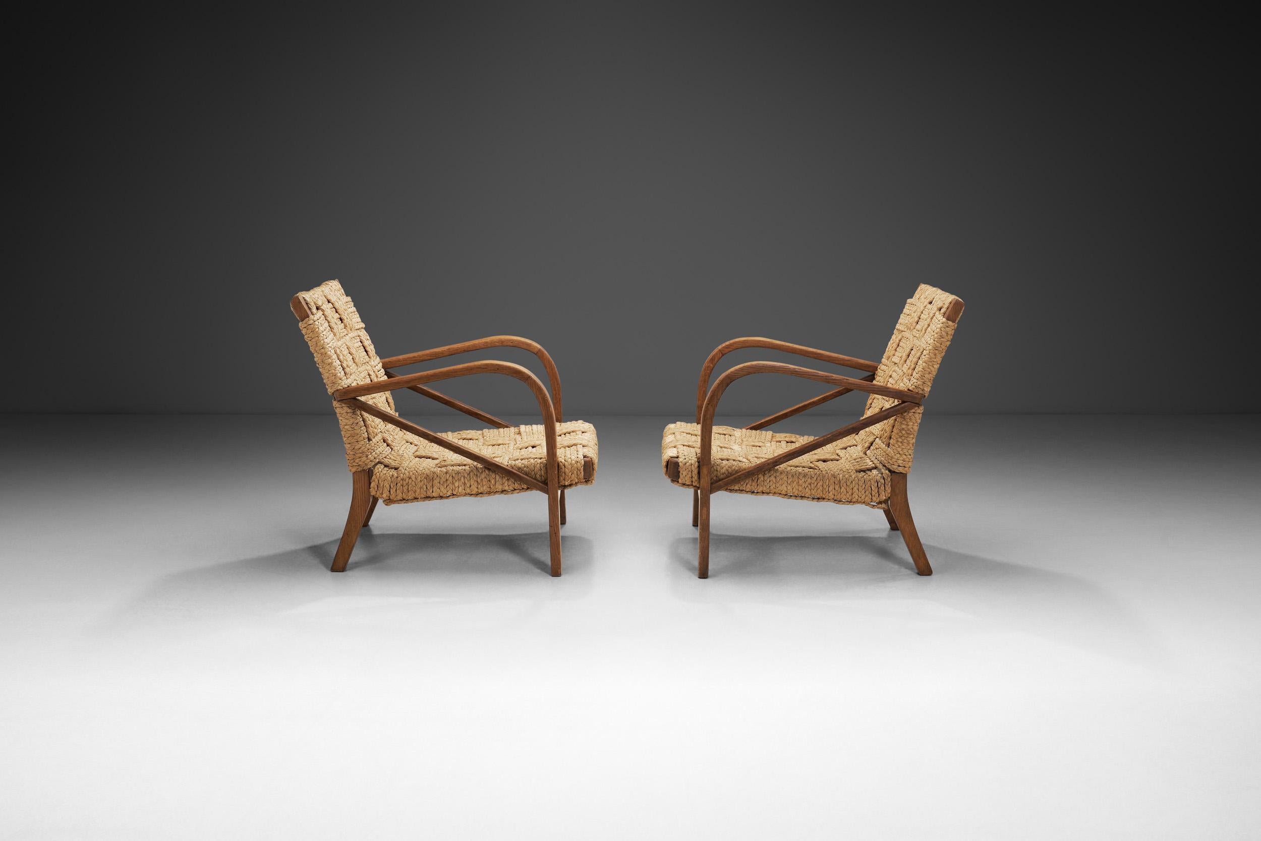 A Pair of Woven Rope Armchairs by Audoux-Minet, France ca 1950s In Good Condition In Utrecht, NL