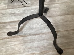 A Pair of Wroght Iron and Brass Adjustable Floor Lamps