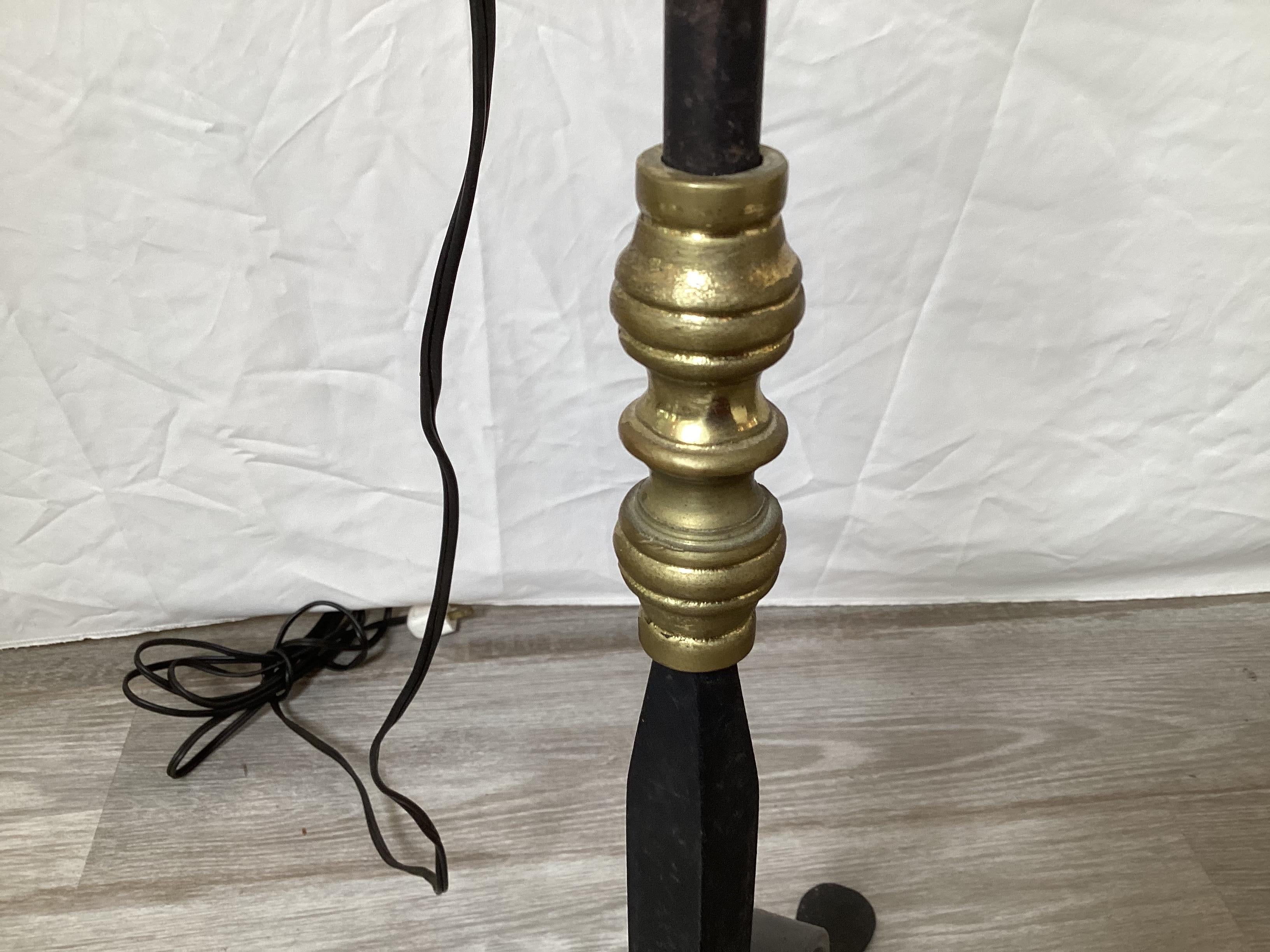 20th Century A Pair of Wroght Iron and Brass Adjustable Floor Lamps For Sale