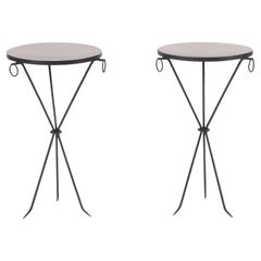 A pair of wrought iron drink tables with parquet tops. Contemporary