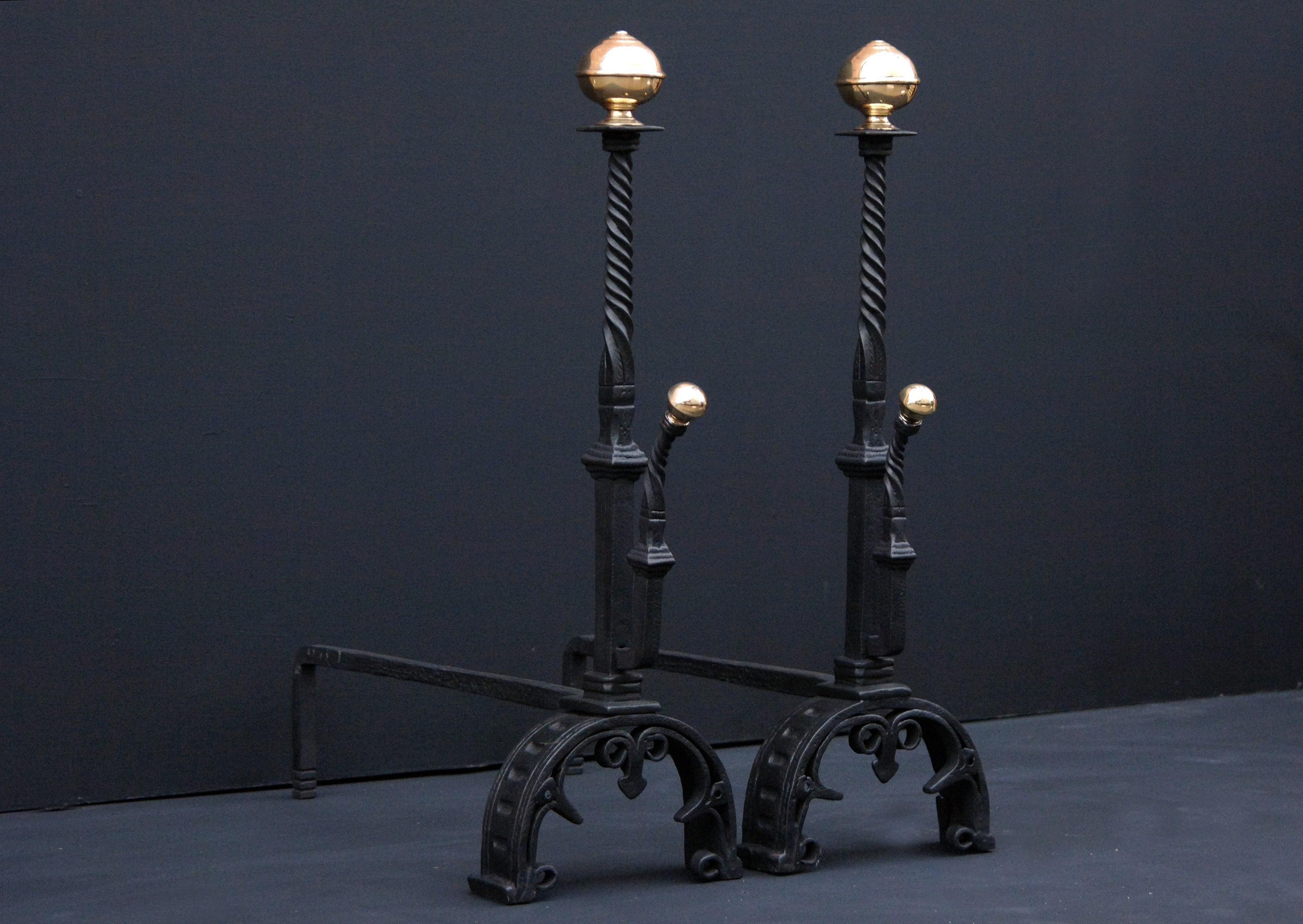 A pair of good quality 19th century wrought iron firedogs with barley twist to tops of shafts, brass ball finials, scrolls to base.

Height:	720 mm      	28 ⅜