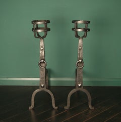 A Pair of Wrought Iron Cresset Fireplace Andirons