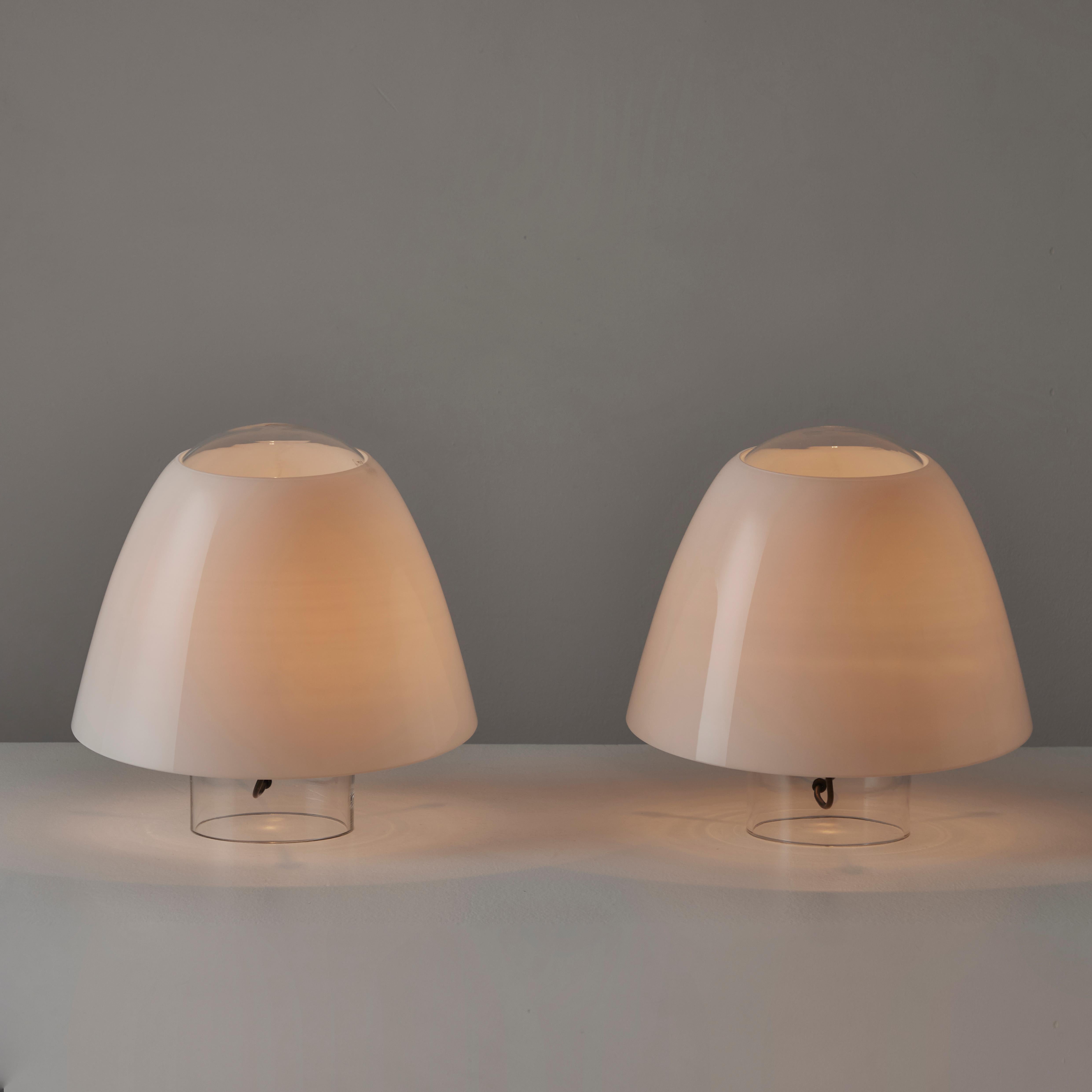 A Pair of XL Mod. 'Polluce' Table Lamps by Angelo Mangiarotti for Skipper. Designed and manufactuired in Italy, circa the 1960s. All glass table lamps comprising of a clear glass hand blown base, topped with a white opaline glass hat. The top hats