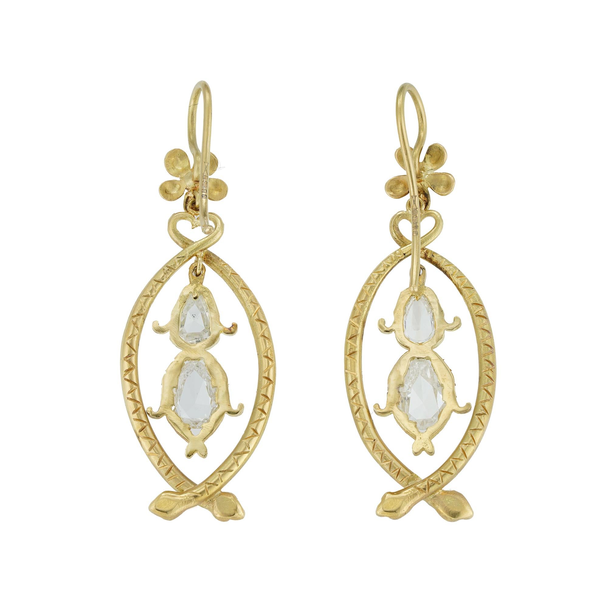 A pair of yellow gold and diamond-set serpent earrings, each earring with two pear-shaped rose-cut diamonds in a navette-shaped frame of yellow gold in the form of two intertwined serpents, surmounted by a yellow gold forget-me-not flower, the