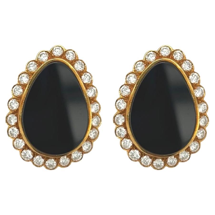 A Pair of Yellow Gold, Black Onyx and Diamond Earrings