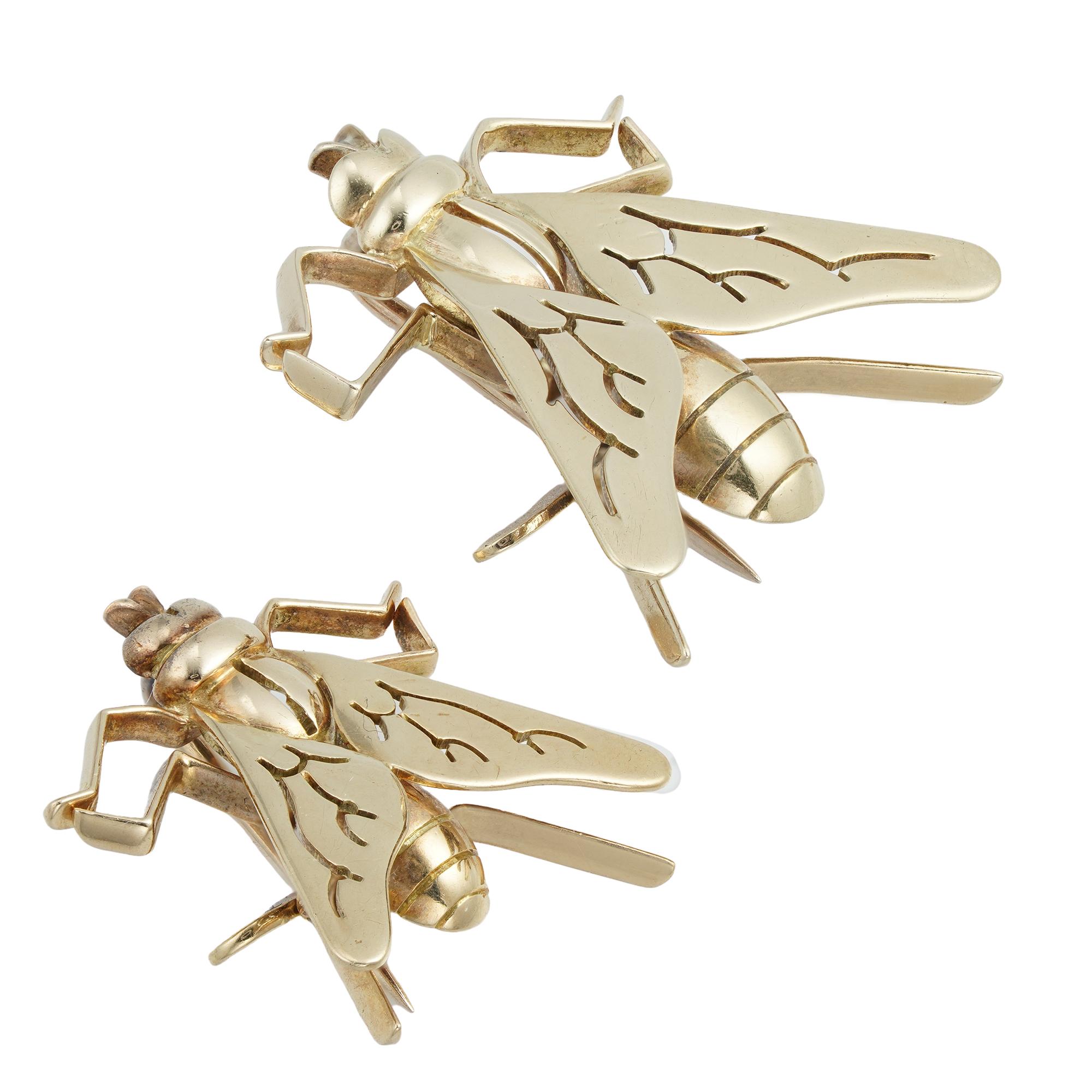A pair of yellow gold fly insect brooches, the larger measuring approximately 2.2 x 2.2cm, signed Boucheron London, the smaller measuring approximately 1.7 x 1.9 cm, circa 1960, gross weight 4.8 grams, later hallmarked 9 carat gold, London.

Should