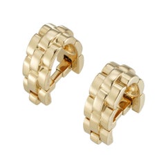 Un par de gemelos Maillon Panthere de oro amarillo de Cartier