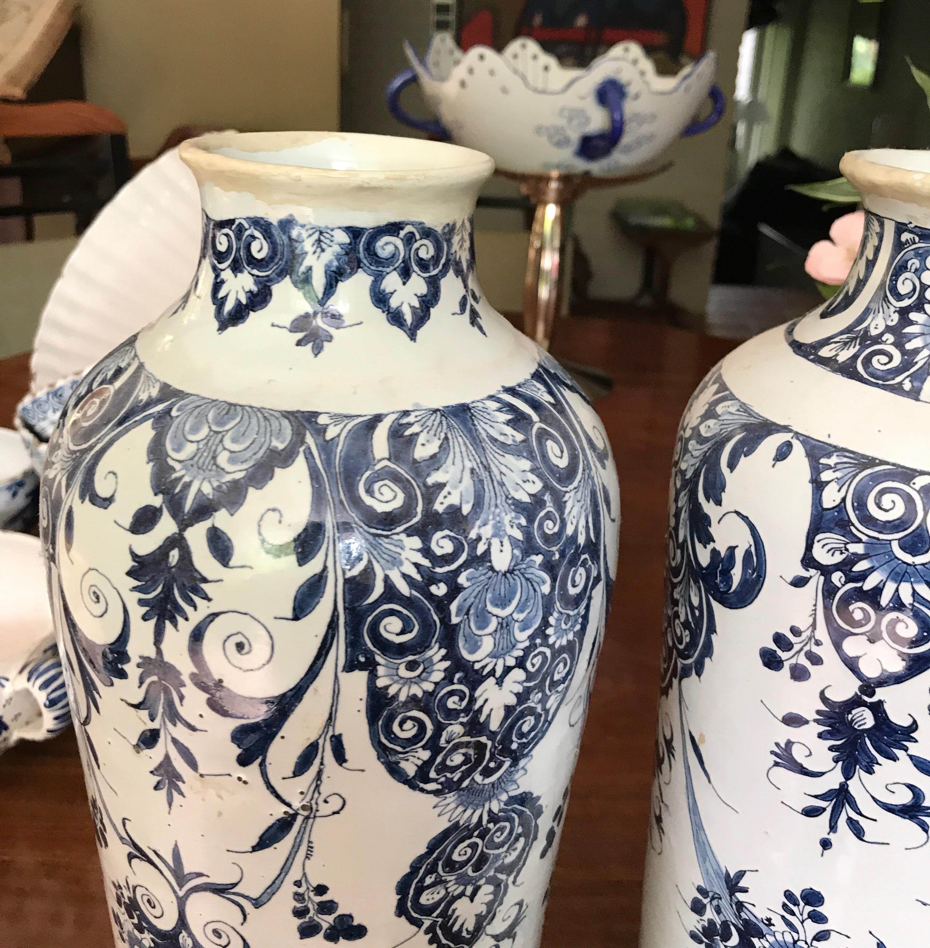 Two delft vases late 18th-early 19th century produced in the Dutch region off delft in the Netherlands
Minor old restorations on the top
No cracks
Marks on the bottom
Beautiful and many different flower patterns on both vases.
 