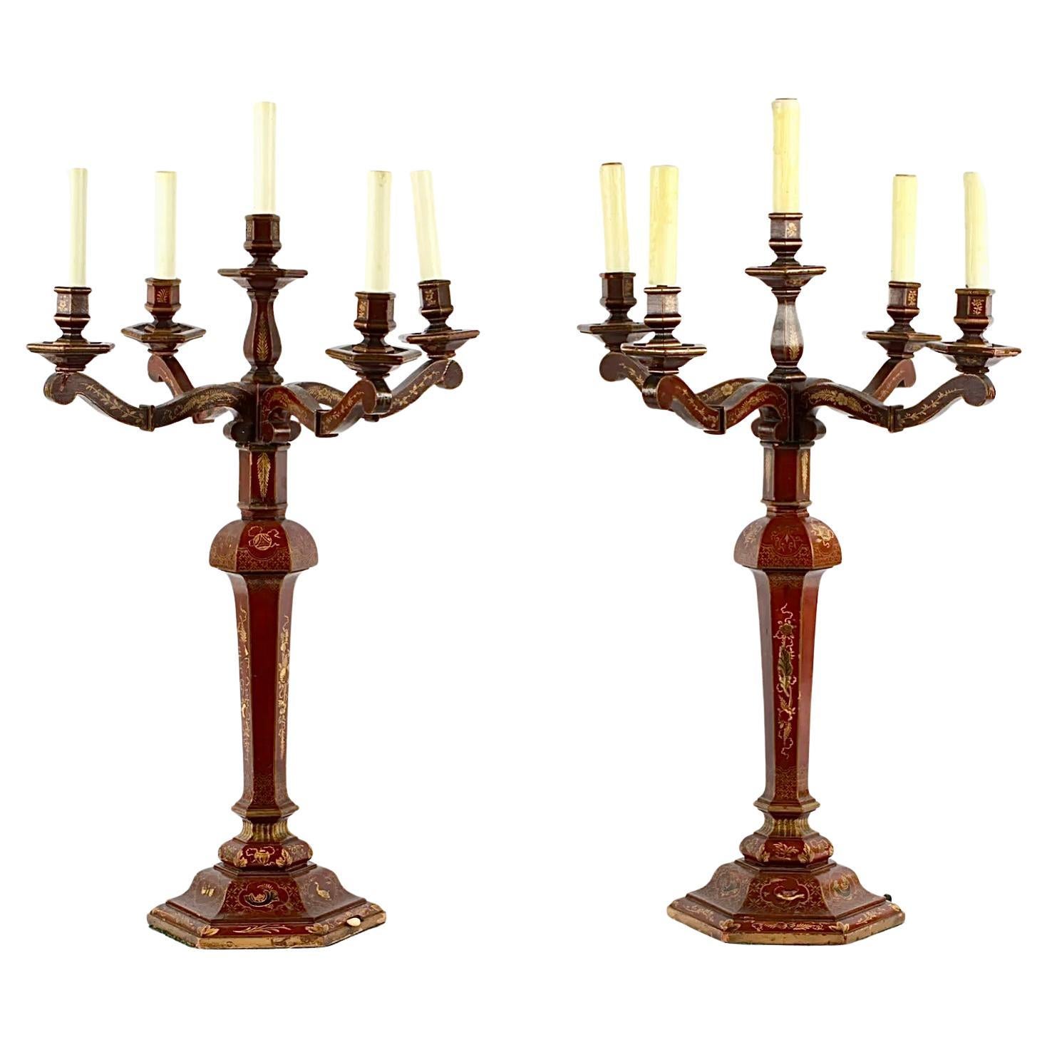 A Beautiful Pair Red Gilt Chinoiserie Candelabra table lamps attributed to E.F. Caldwell, New York. Electrified four candle arms and center light, carved wood with fine red Japanned gilt and polychrome chinoiserie decoration and a felt base. These