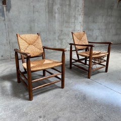 Pair Solid Ashwood and Straw "Bauche" Armchairs by Charlotte Perriand