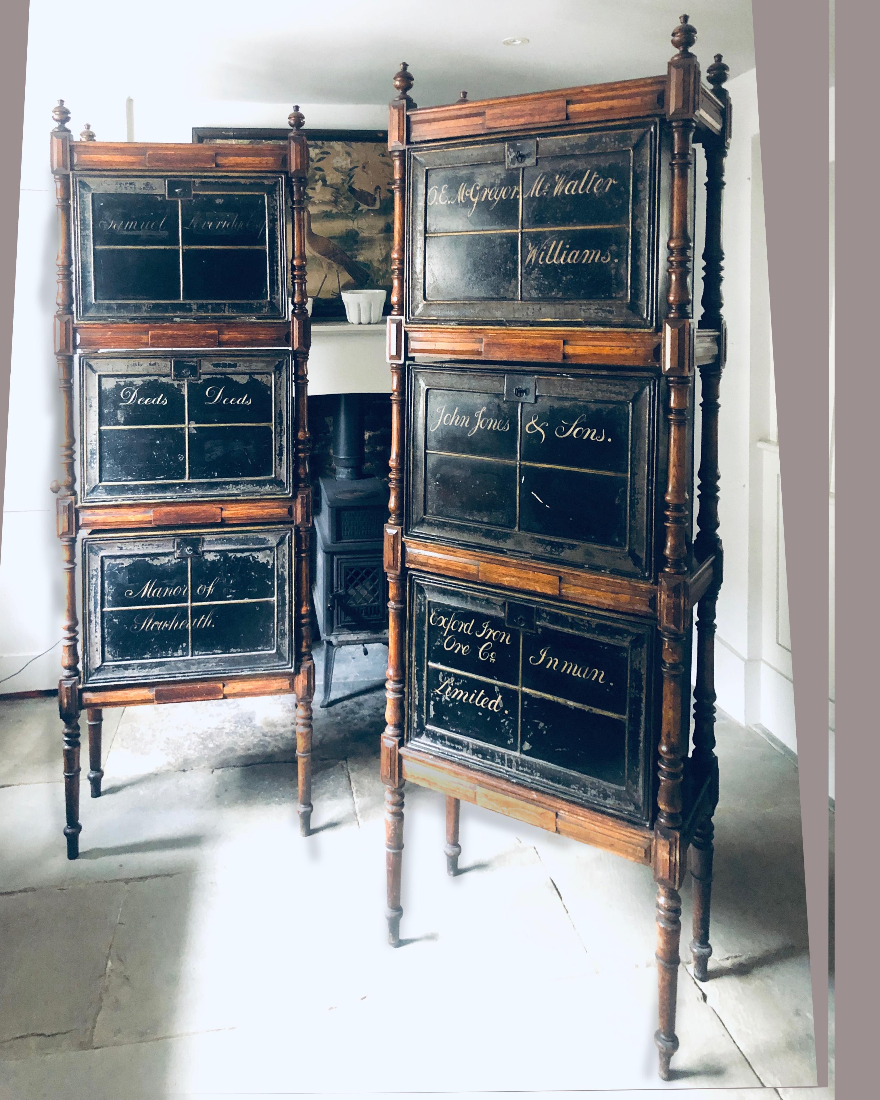 A pair of Victorian turned oak each frame with three black enamelled deed boxes
Each deed box with side carrying handles hinged fall front and working locks
Almost certainly originally part of the furnishings of a prestigious bank or lawyers