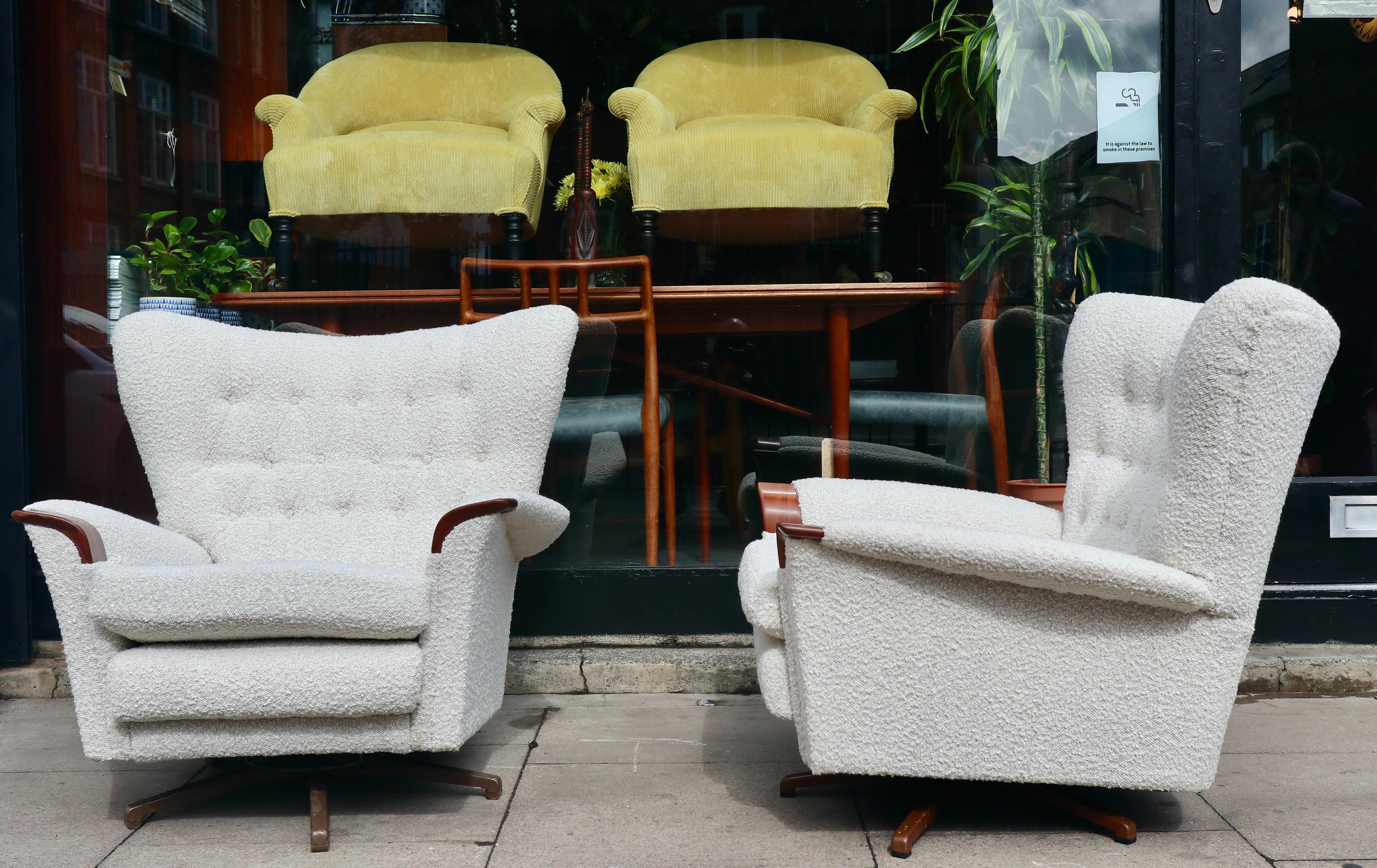 A very rare pair of 1960s vintage g plan swivel lounge chairs on five star metal bases.  These chairs are in excellent vintage condition, having been newly upholstered in cream coloured textured quality textile.