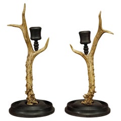 A Pair Antique Black Forest Candle Holders with Wooden Base and Spout