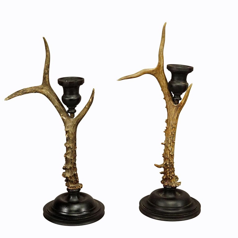 A Pair Vintage Black Forest Candle Holders with Wooden Base and Spout