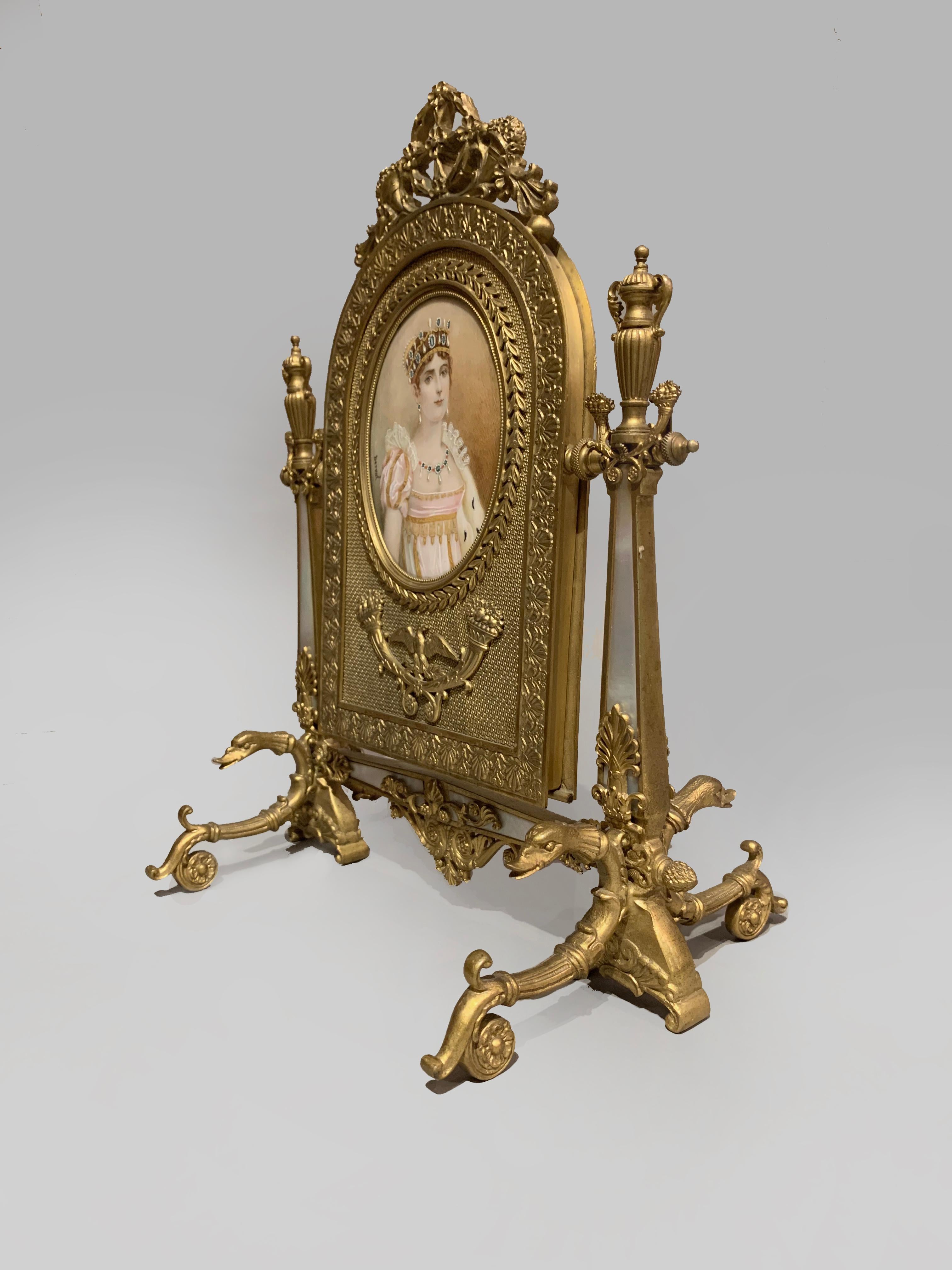 A Palais Royal gilt bronze and mother of pearl toilet mirror.

French, circa 1850.

A Palais Royal gilt bronze and mother of pearl toilet mirror, of Second Empire design with arched bevelled glass plate and inset with a portrait miniature of an