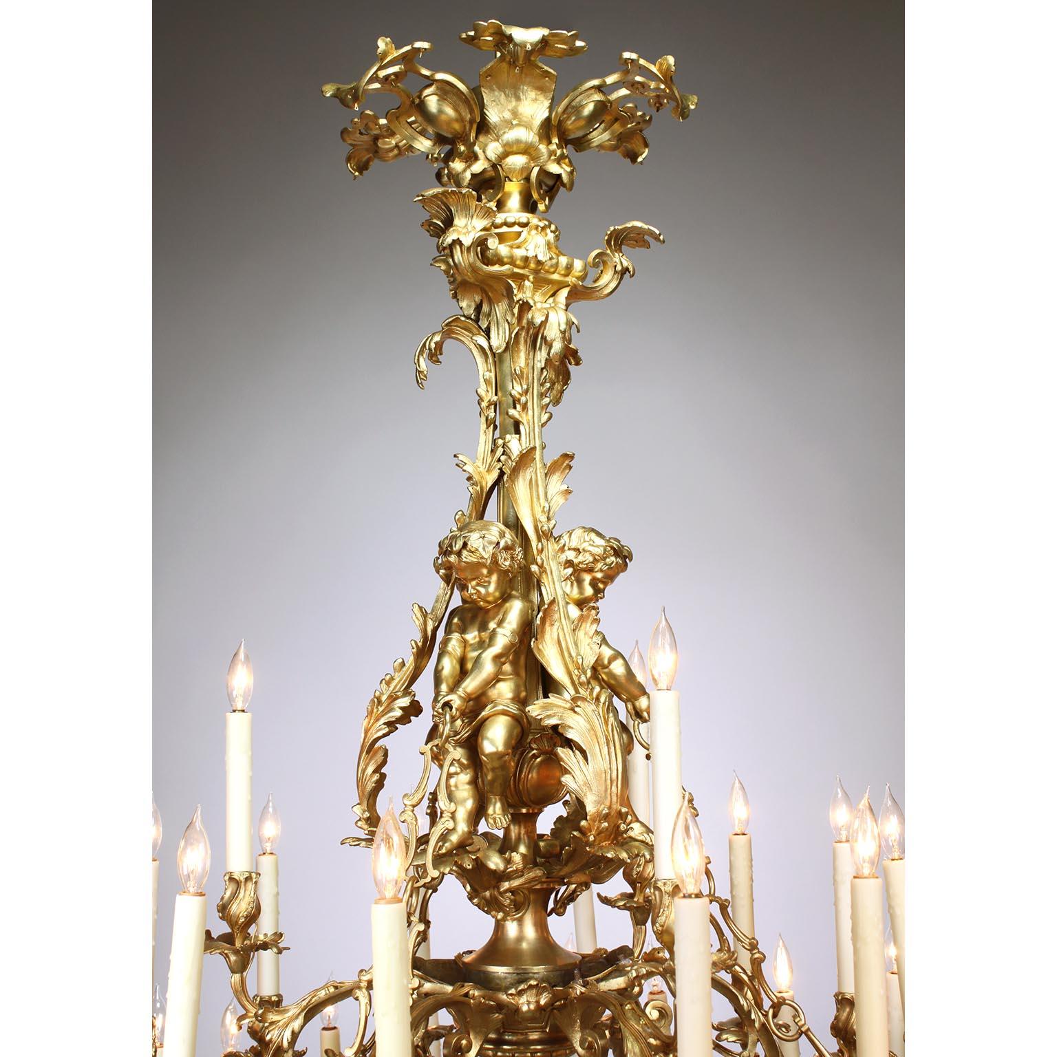 Palatial French 19th Century Louis XV Style Gilt-Bronze 39-L Cherub Chandelier In Fair Condition For Sale In Los Angeles, CA