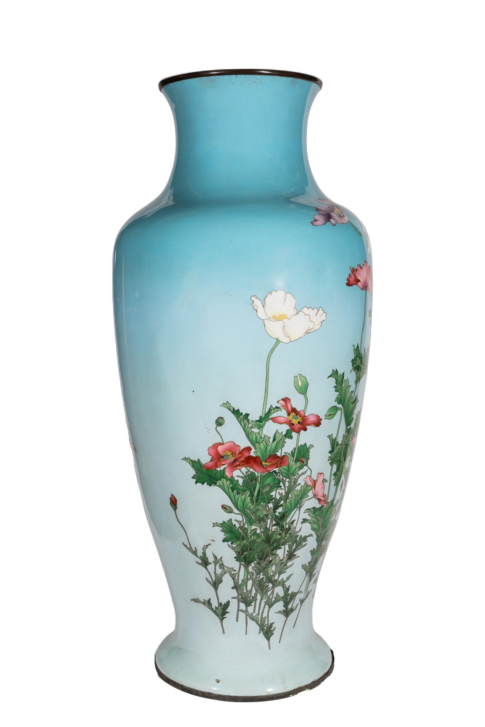 Presenting a palatial Japanese Cloisonné Enamel Vase, attributed to Kawade Shibataro adorned with Poppy flowers blooming on a powder blue canvas. This exceptional piece showcases the pinnacle of Japanese cloisonné craftsmanship, capturing the beauty