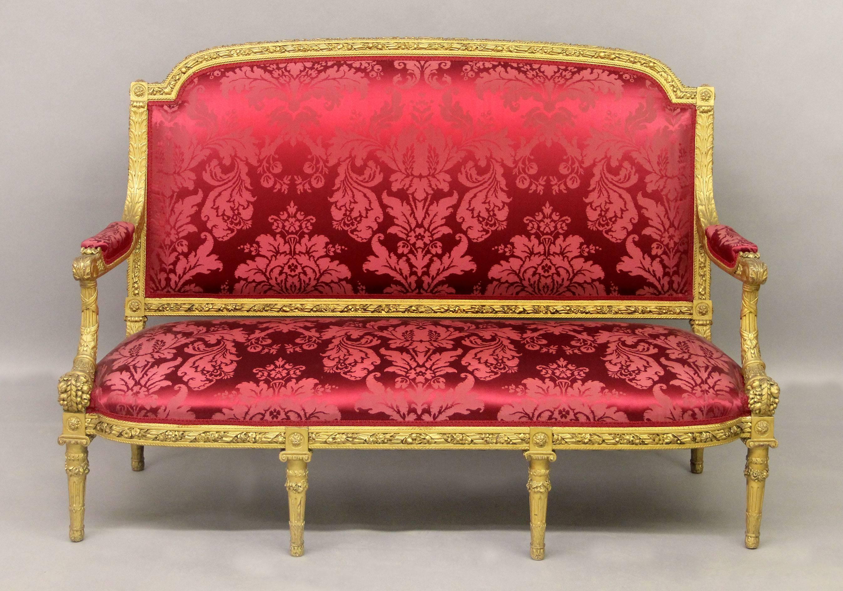 A Palatial late 19th century seven piece Louis XVI style giltwood carved parlor set

The fantastic and heavily carved set consists of four arm chairs, two side chairs and a settee, each with wonderful floral and rope carved frames, cornucopia