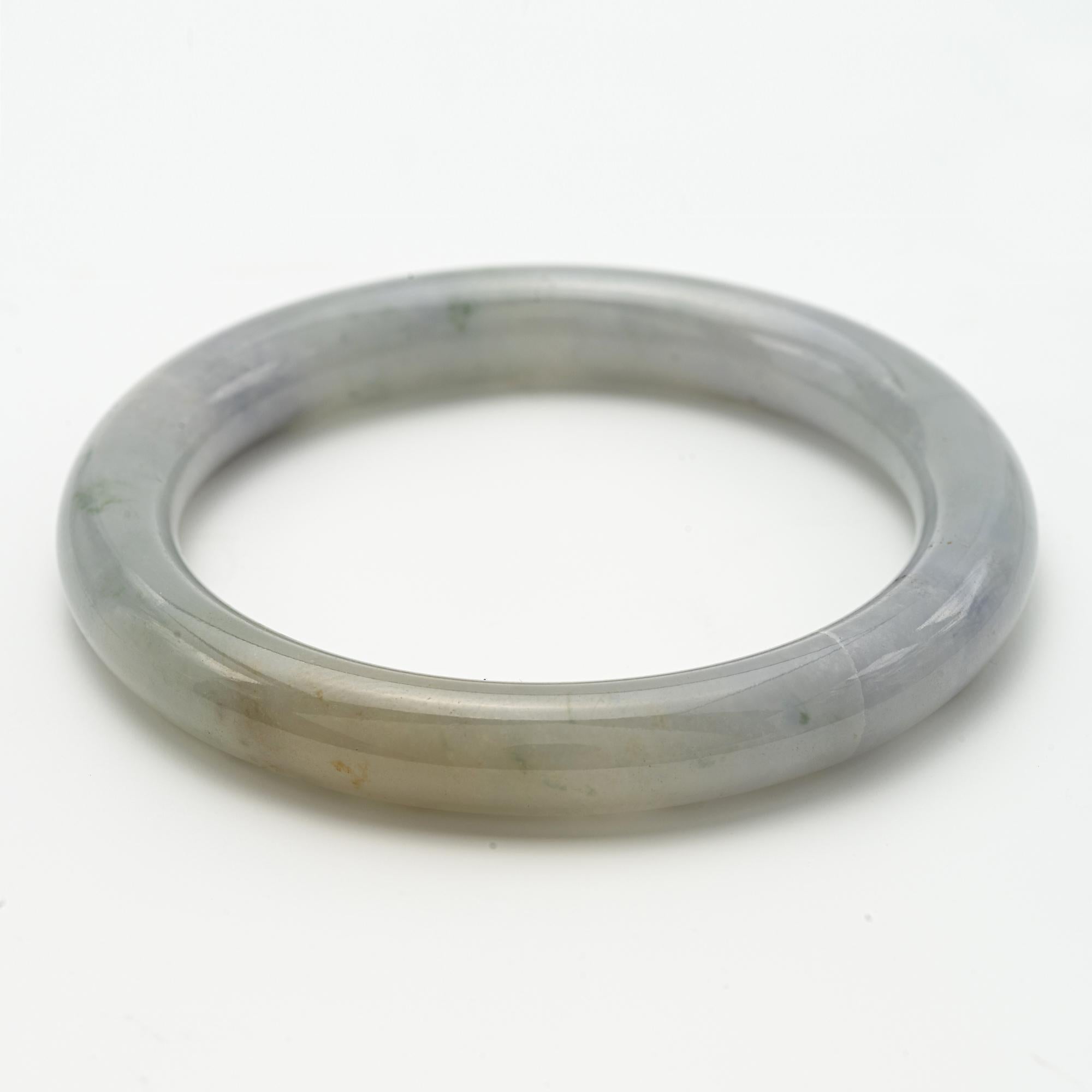 
A Pale Celadon Jade Bangle
the bangle with subtle evergreen inclusions
2 inch circumference
