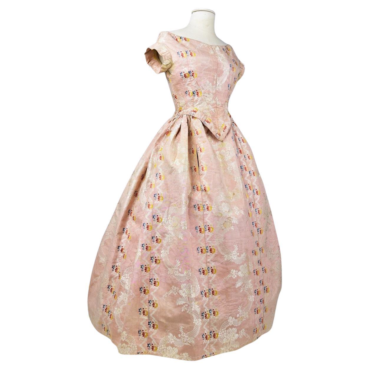 A Pale pink brocaded Moiré silk Crinoline ball gown Circa 1860 For Sale