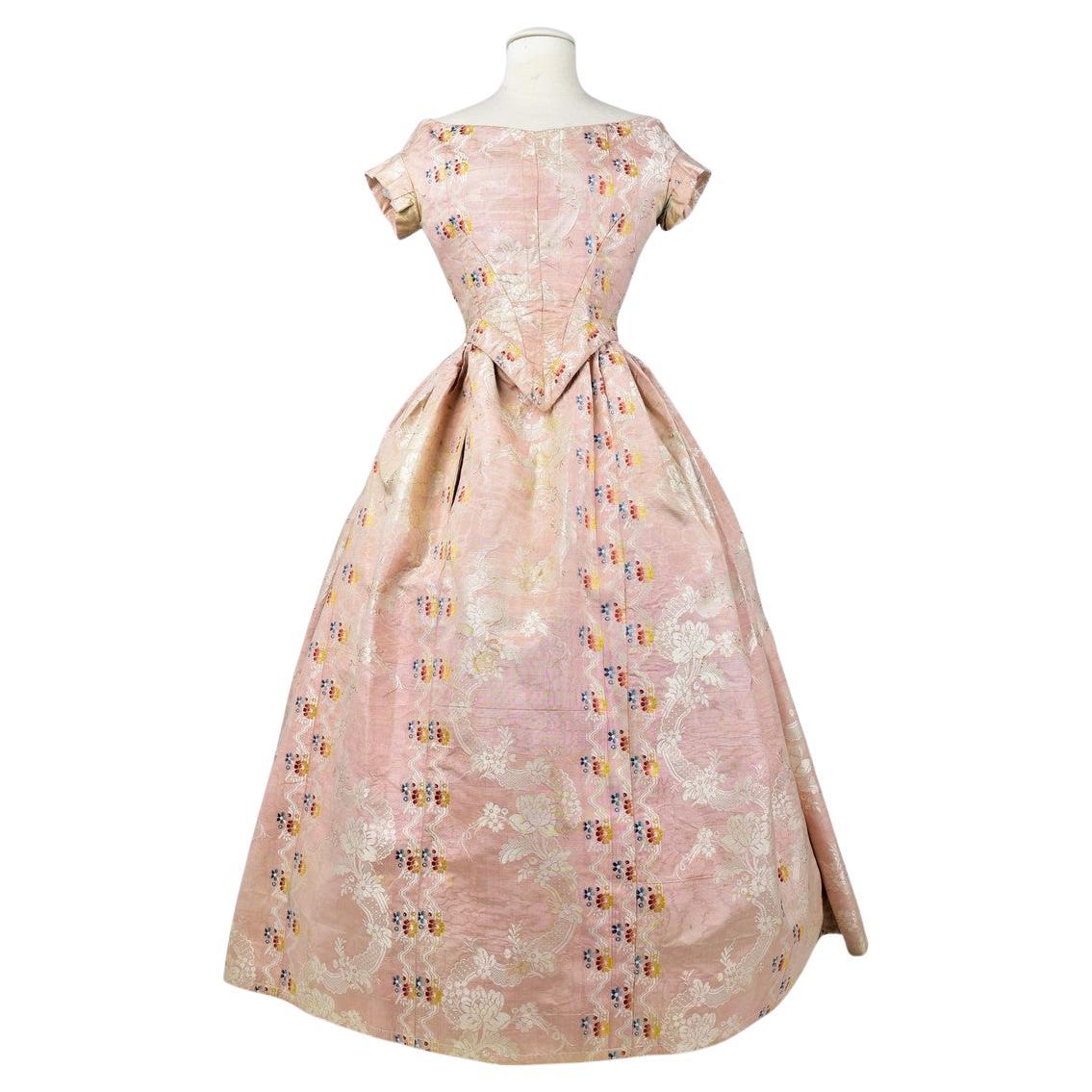 A Pale pink brocaded Moiré silk Crinoline ball gown Circa 1860 For Sale