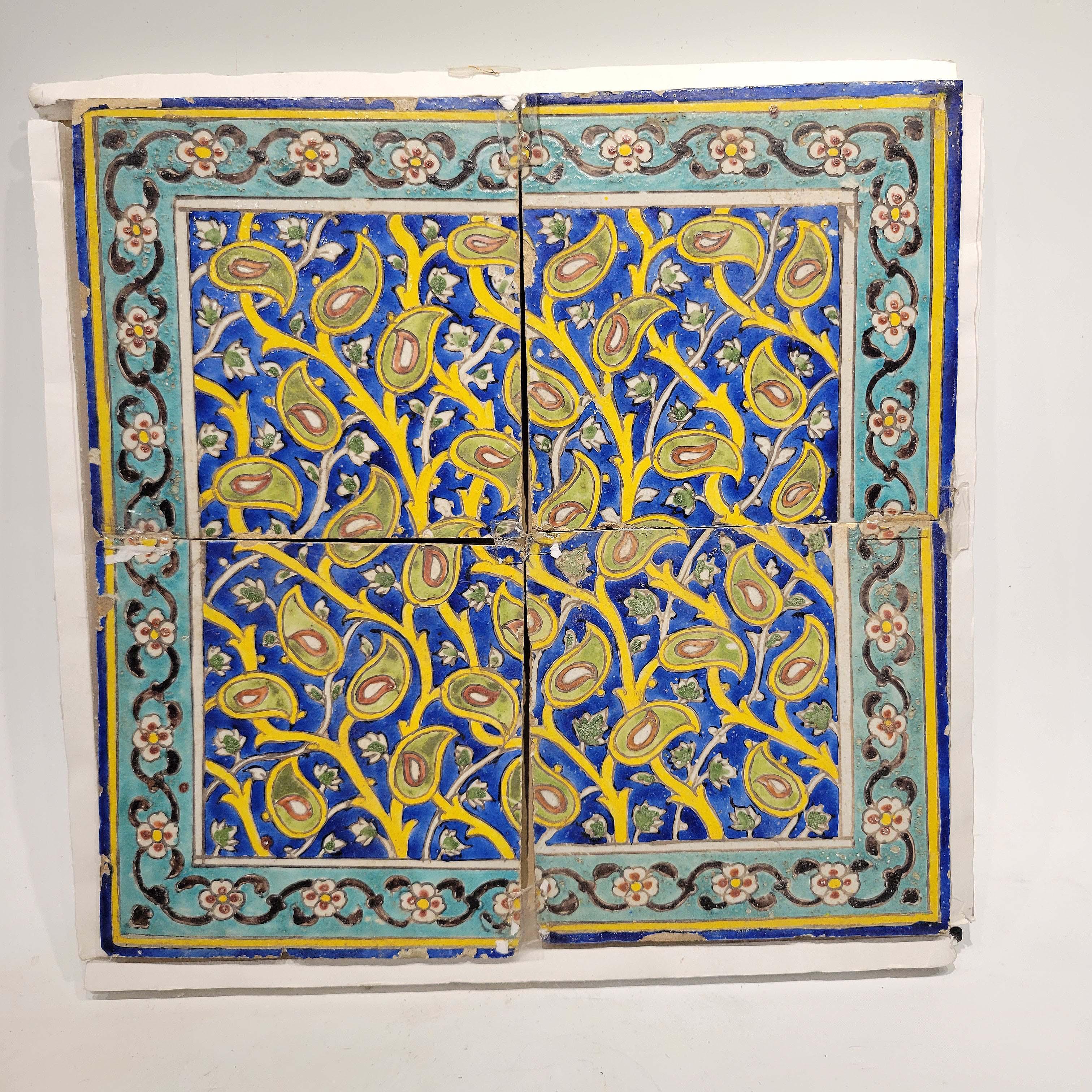 A panel of four late Safavid or Zand cuerda seca tiles, probably Isfahan, late 17th or early 18th century.
The set of tiles are matched to form a wonderful floral design in vibrant colors of yellow, turquoise, green, cobalt and rust.
Minor chips