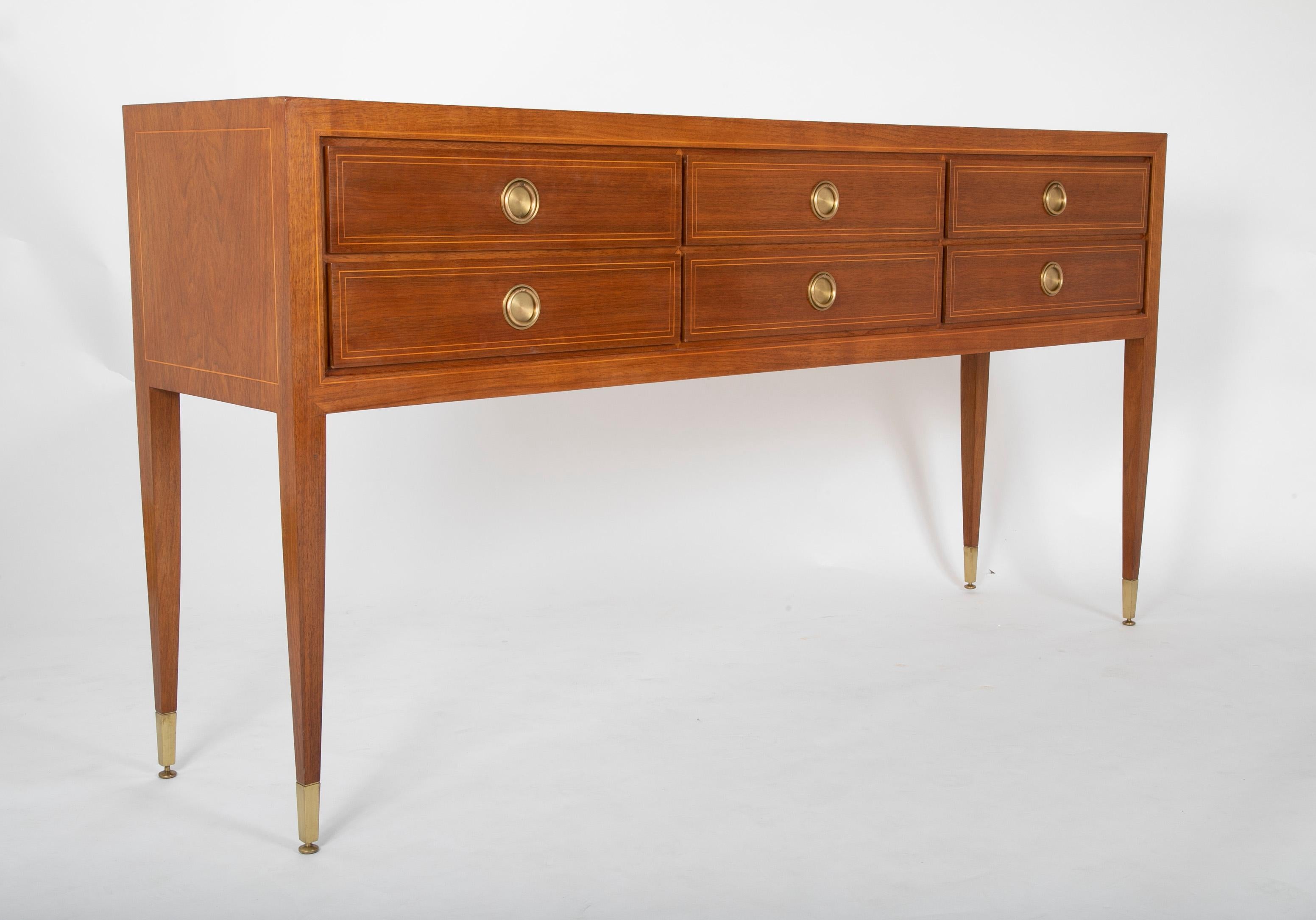 A mahogany sideboard with minimal fruitwood stringing. Legs terminating in brass Sabot with brass ring handles with backplates. Produced by Prod. Marelli e Colico, Italy, circa 1930. 