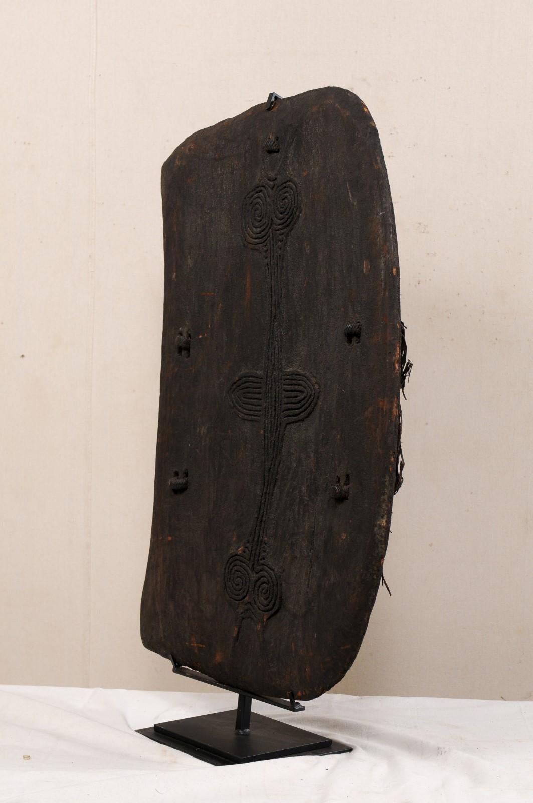 Papua New Guinea Carved-Wood Lumi Shield on Custom Iron Stand For Sale 7