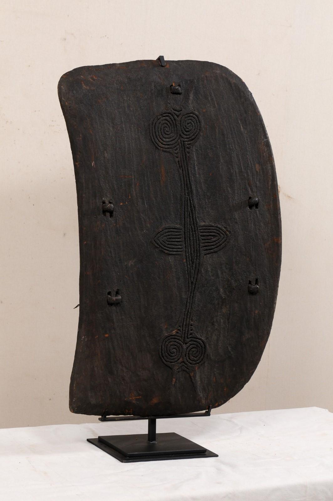 Papua New Guinea Carved-Wood Lumi Shield on Custom Iron Stand For Sale 1