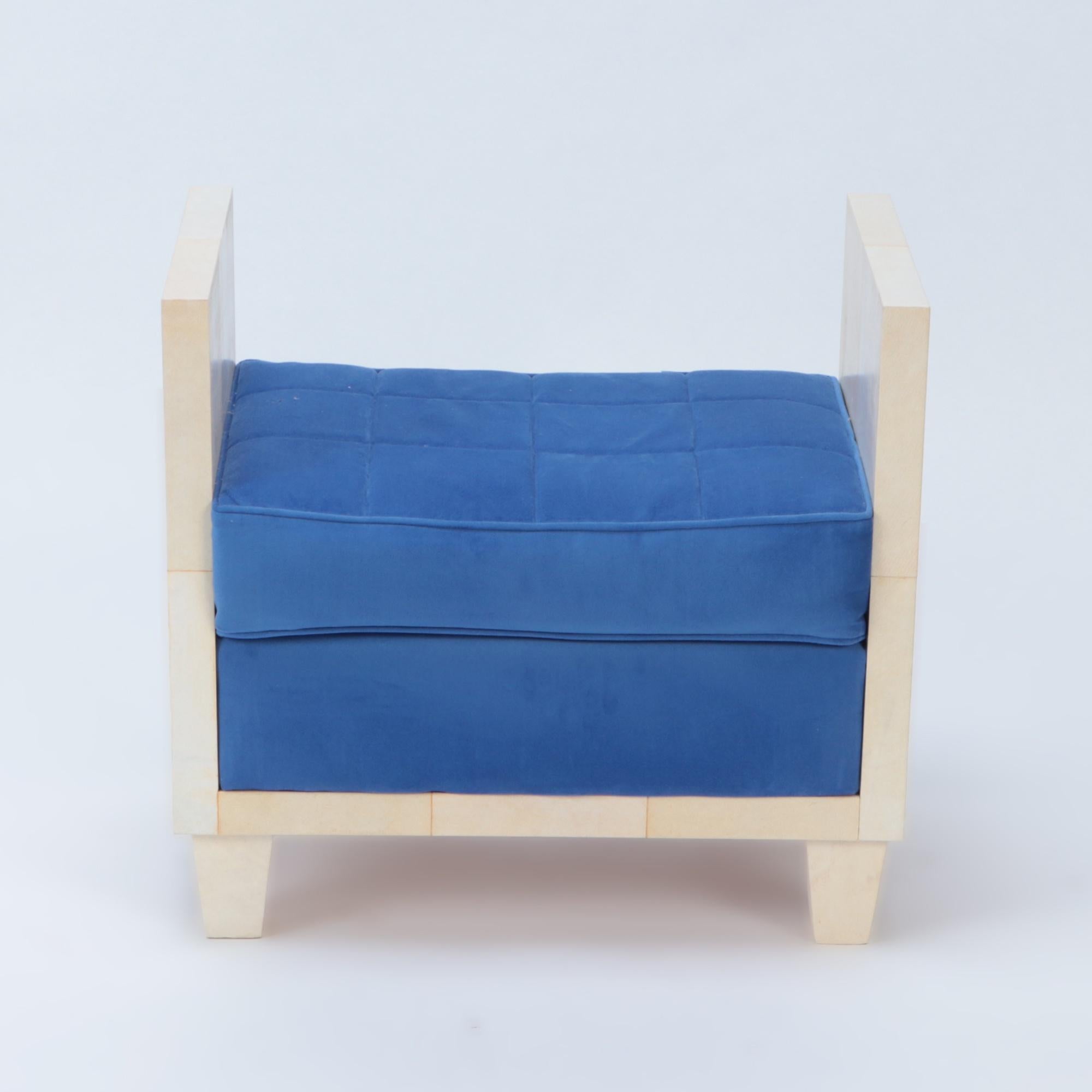 A parchment and upholstered bench in the manner of Jean-Michel Frank. Contemporary.