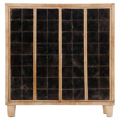 A parchment covered cabinet in the manner of Jean-Michel Frank C 1945.